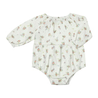 Floral-patterned baby romper on a white background