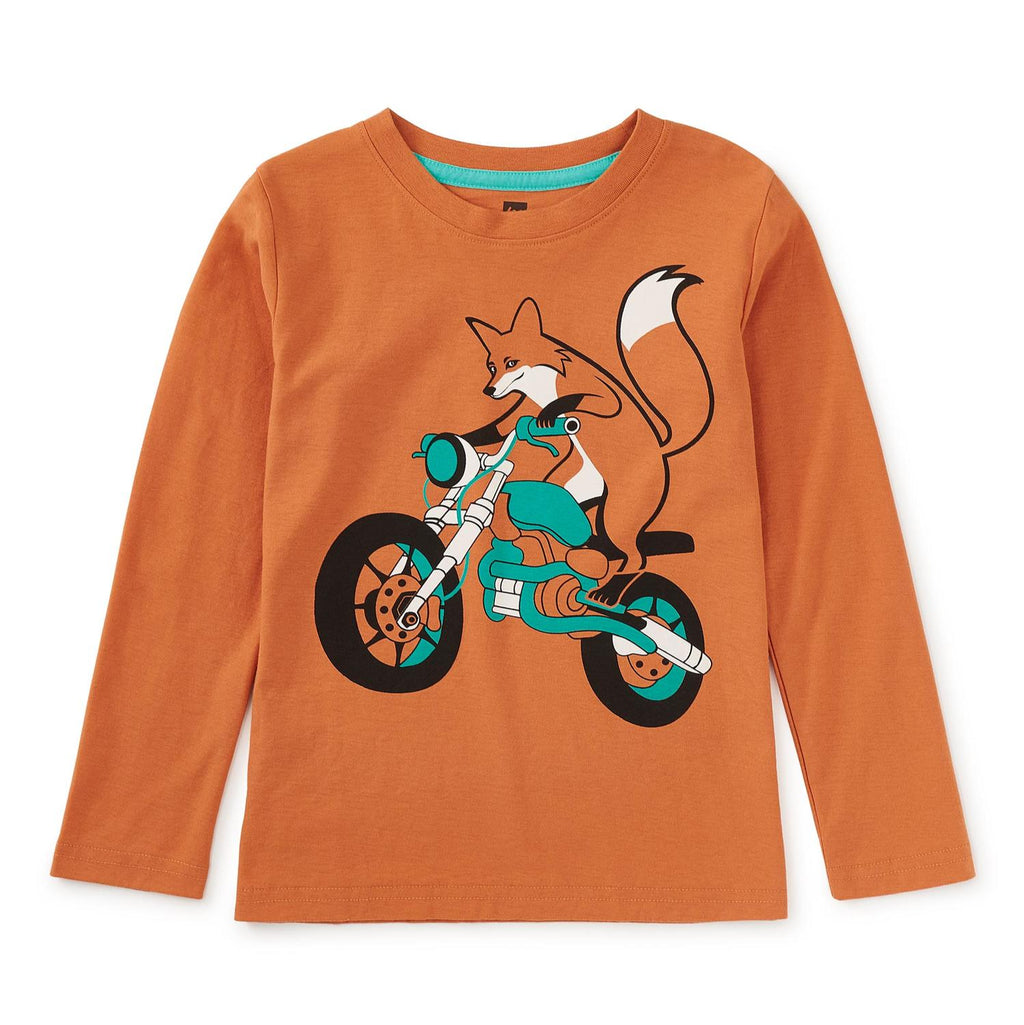 Orange long-sleeve shirt with a fox riding a motorbike graphic on a white background