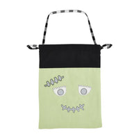 Bag with a monster face design on a white background
