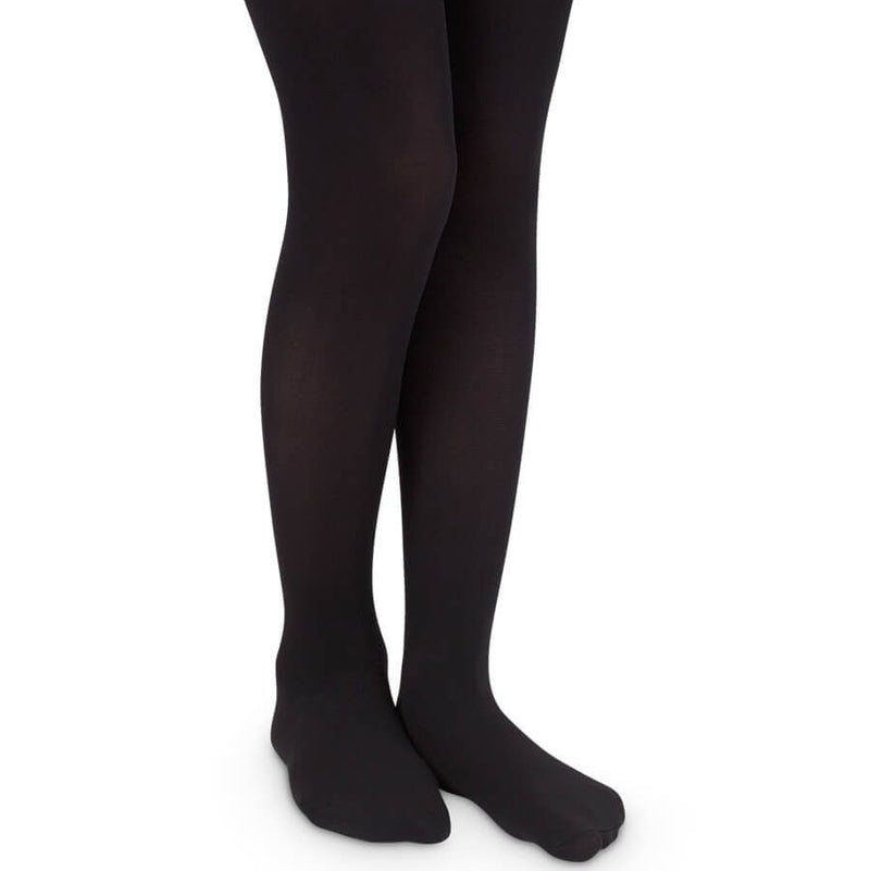 Black tights worn by a person on a white background