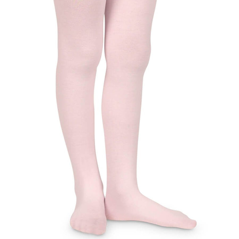 Pink tights worn by a person on a white background