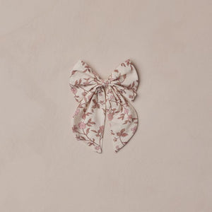 Floral bow on a beige background
