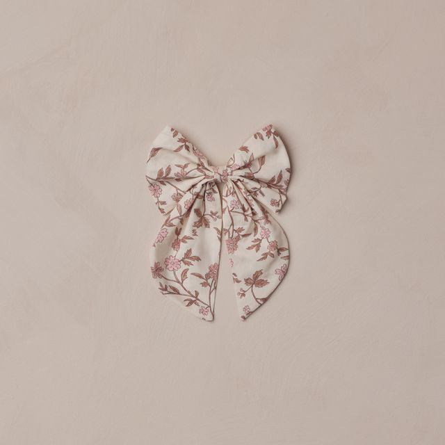 Floral bow on a beige background