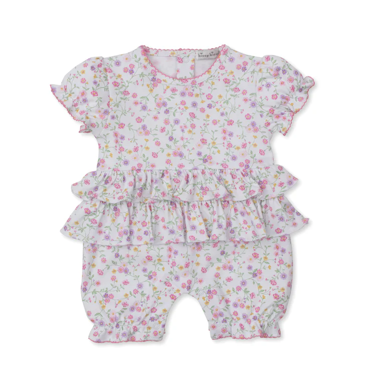 Floral baby romper on a white background