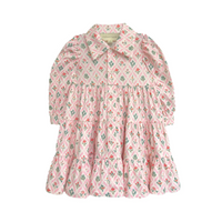 Floral button down dress with long sleeves and collar on a white background