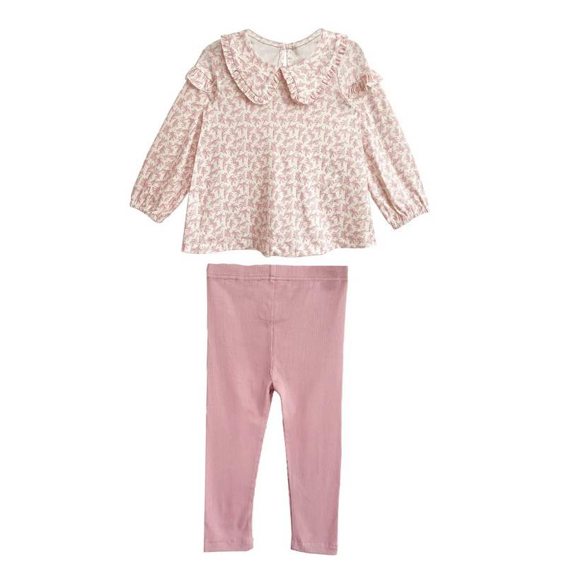 Pink floral top and pants set on a white background