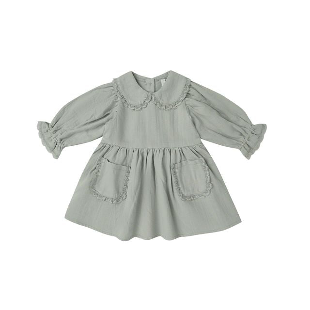 Light fern green dress with ruffled collar on a white background