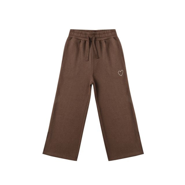 Brown pants with a heart design on a white background