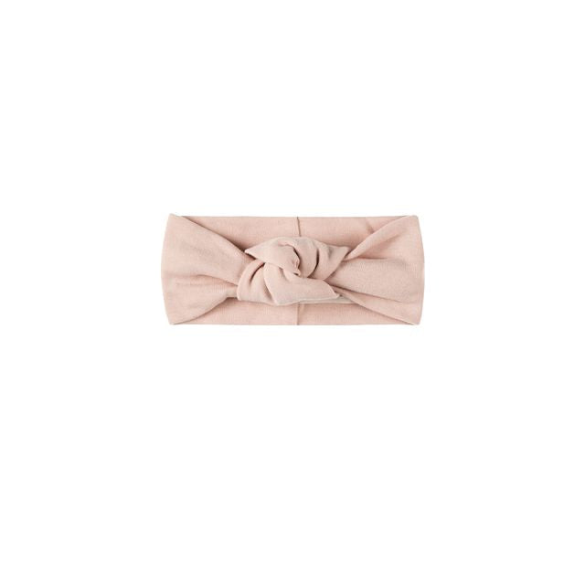 Pink headband with a knot on a white background
