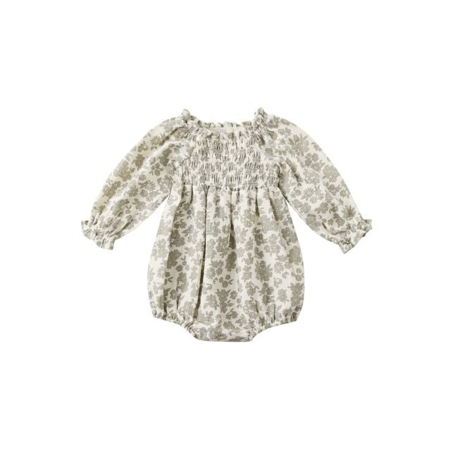 Floral-patterned baby romper on a white background