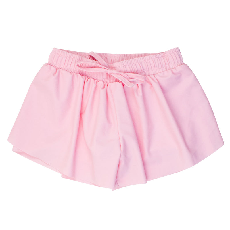 Pink flutter shorts with an elastic and drawstring waist on a white background