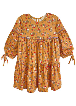 Yellow dress with floral pattern on a white background
