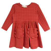 Red checkered dress with scalloped pockets on a white background
