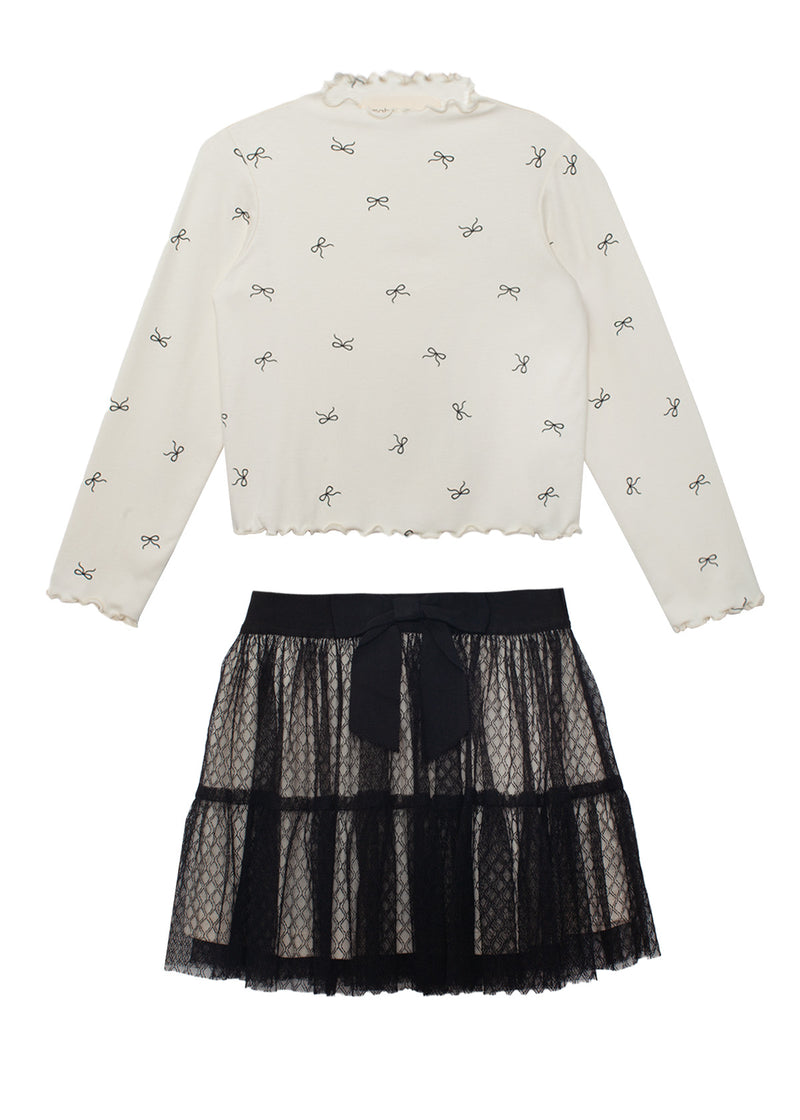 White blouse with bow pattern and black lace skirt on a white background