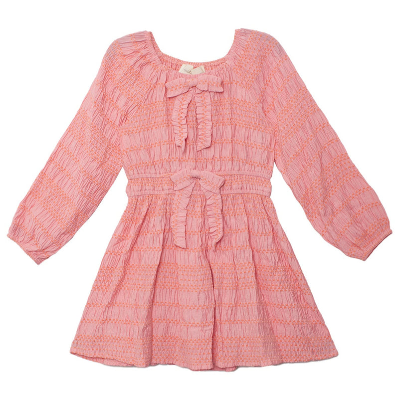 Pink dress with long sleeves and a bow detail on a white background