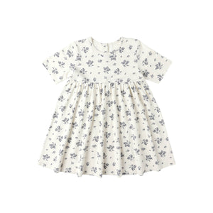 White dress with blue floral pattern on a white background