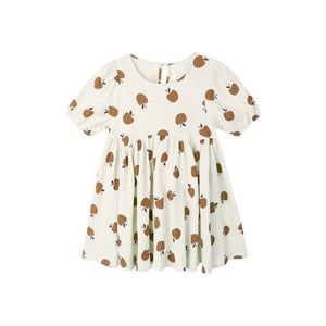 White dress with golden apples pattern on a white background