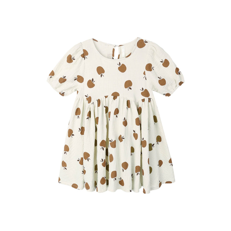 White dress with golden apples pattern on a white background