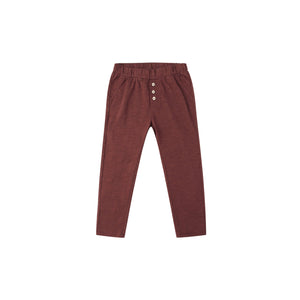 Maroon pants with button details on a white background