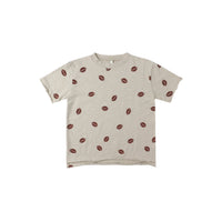 Beige t-shirt with football pattern on a white background