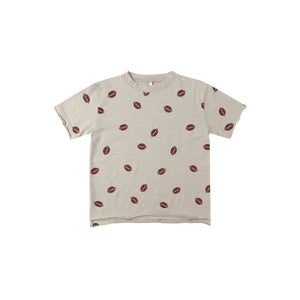 Beige t-shirt with football pattern on a white background