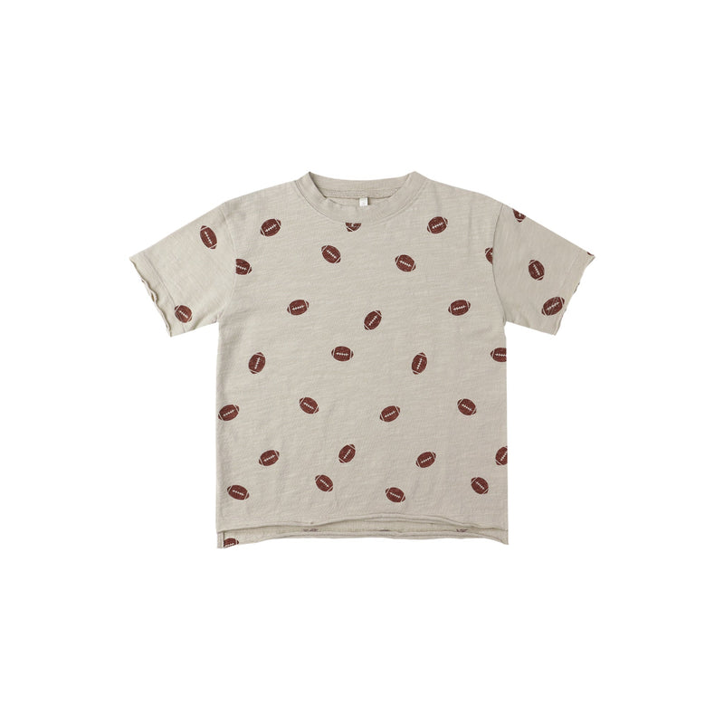 Beige t-shirt with football pattern on a white background
