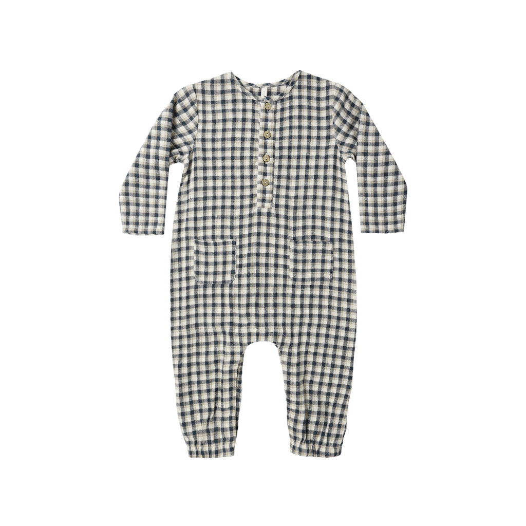 Navy and white checkered baby coverall on a white background