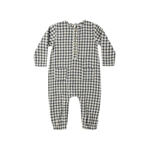 Navy and white checkered baby coverall on a white background