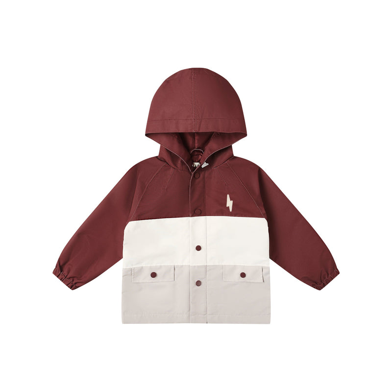 Two-tone jacket with maroon hood and beige lower half on a white background