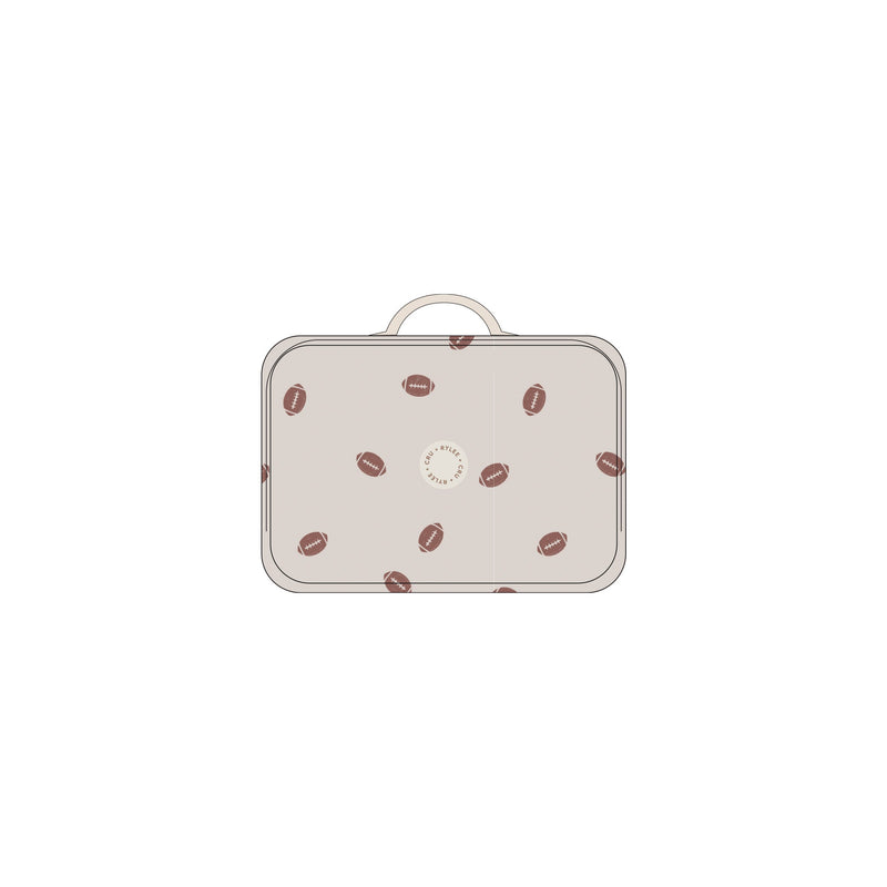 Small suitcase with football pattern on a white background