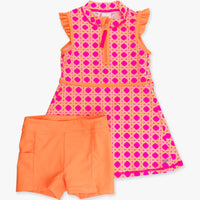 Pink and orange dress with matching shorts on a white background