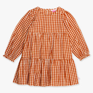 Orange and white gingham dress on a white background