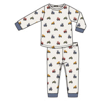 Children's pajama set with tractor pattern on a white background