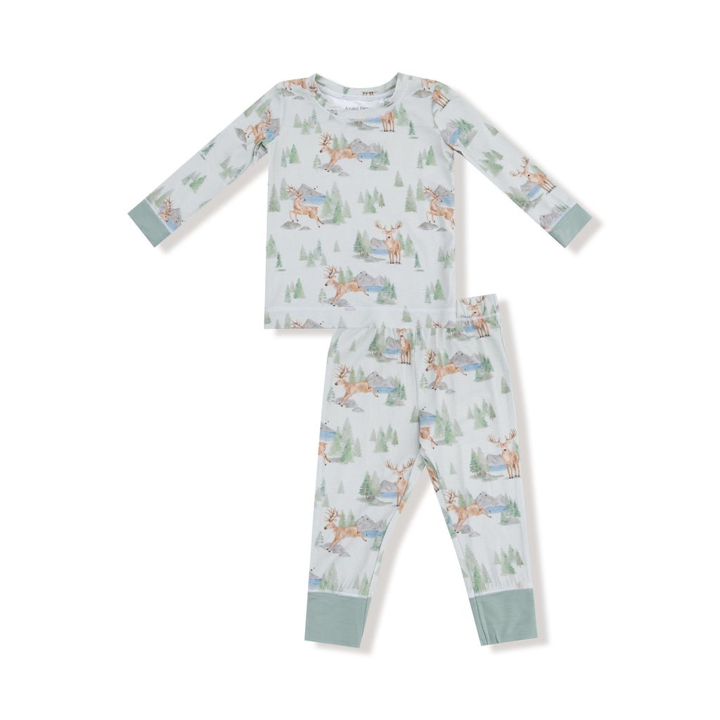 Children's pajama set with forest deer pattern on a white background