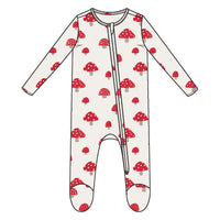White baby onesie with red mushroom pattern on a white background