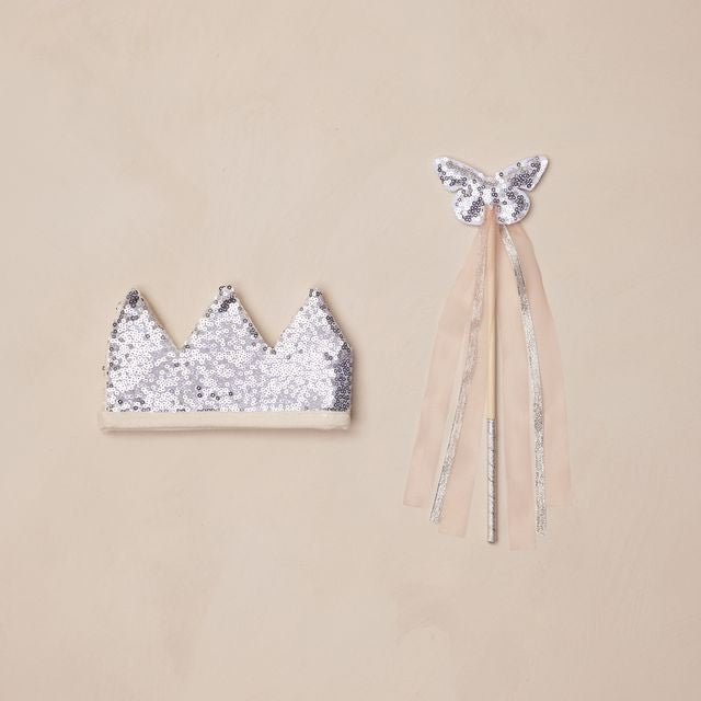Silver sequin crown and wand with tulle on a beige background